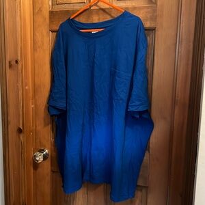 Mens royal blue I believe be short sleeve ent shirt with pockets Tom the front.